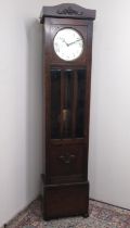 C20th oak long cased clock, with glazed door, circular silvered Arabic dial with three train