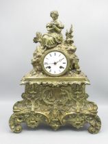 C19th / C20th French brass rococo style figural mantle clock, the cast brass case surmounted with