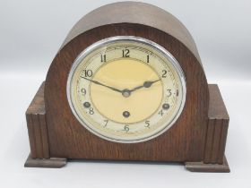 Garrard Clocks Ltd., oak mantle clock, arched top case with applied walnut trim, chrome plated bezel