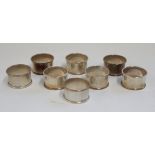 Set of eight ER.II hallmarked silver napkin rings of plain form, each with individual fitted box,