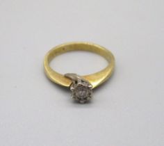 18ct yellow gold diamond solitaire ring, the brilliant cut diamond in white illusion setting,