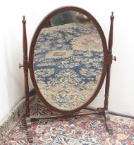Geo.111 style mahogany toilet mirror, oval plate on ring turned supports with cabriole legs, W50cm