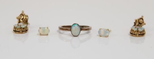 Yellow metal and cabochon opal ring with matching earrings together with a pair of yellow metal