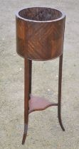 An early C20th mahogany jardiniere stand on 3 square out-splayed legs and under tier. H96cm