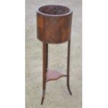 An early C20th mahogany jardiniere stand on 3 square out-splayed legs and under tier. H96cm