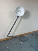 Grey metal anglepoise type floor lamp, on circular base