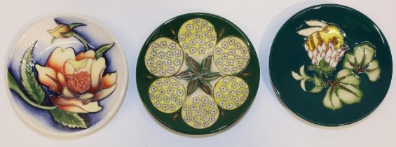 Moorcroft Pottery: three pin dishes/coasters with designers' signatures - 'Pinxit Rose', designed by