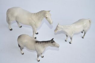 Three Beswick ceramic horse figurines, 2 in gloss finish, 1 matt, larger gloss example with repaired