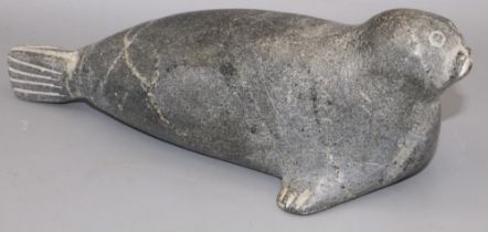 C20th Inuit carved soapstone sculpture of a seal, incised signature 'SUG' and numerals 140813, '