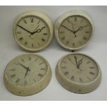 Four Smiths Sectric electric wall clocks retailed by Eastern Watch, Bombay in painted metal cases