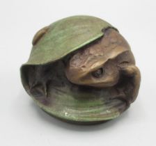 C20th Century Russian resin paperweight modelled as a frog sheltering beneath a leaf, marked beneath