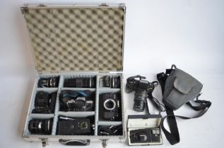 Collection of 35mm film cameras and accessories to include an Olympus OM10 SLR with Olympus 28mm,