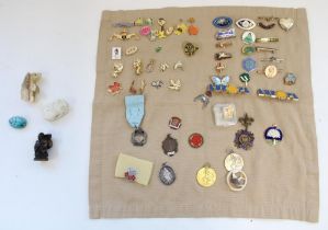 Enamel club and association badges, medals and fobs together with a carved hardstone bear, stone