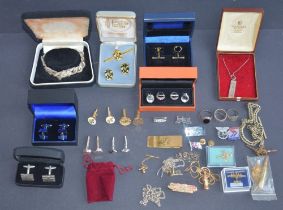Collection of cuff-links, neck chains, pin badges and rings