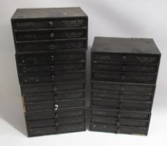 Seven early C20th Carp's 'Touch' three drawer material covered wood cotton reel chests, some