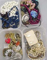 Collection of costume jewellery including brooches, beaded necklaces, faux pearls etc.