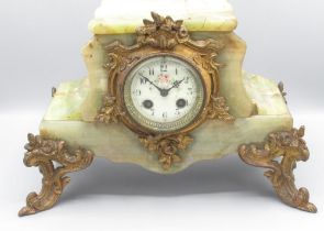 A. D Mougin C19th French onyx mantle clock, shaped stepped case with gilt rococo mounts, porcelain