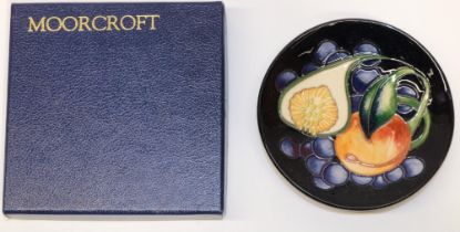Moorcroft Pottery: pin dish/coaster decorated with peach, fig and blue berries, variant of the '
