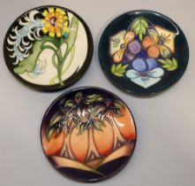 Moorcroft Pottery: three MCC Moorcroft Collectors Club pin dishes/coasters - 'Triple Choice',