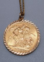 ER.II 1966 sovereign in 9ct yellow gold mount, stamped 375, on 9ct yellow gold chain, stamped 9c,