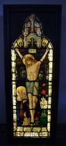 WW1 Commemorative leaded stained glass panel of the Crucifiction, illuminated in wooden frame, W71cm