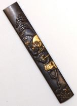 Japanese 17th century Kodzuka grip possibly by Mumia with Samuria on horseback design with gold