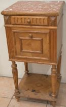 C20th French walnut bedside cabinet, with rouge marble top and frieze drawer above fall front with