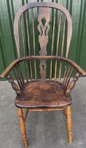 C19th ash and elm high back Windsor chair with pierced splat and shaped seat on turned supports with