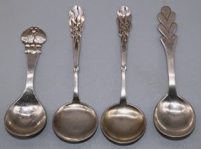 Pair of small C20th Danish silver serving spoons with stylized handles and circular bowls, stamped