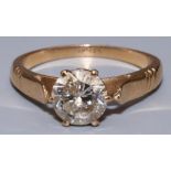 18ct yellow gold diamond solitaire ring, the single brilliant cut diamond in claw setting on tapered