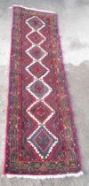 Multicoloured Caucasian runner, field with seven stepped hooked medallions in multi striped