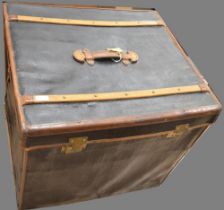 Early C20th large leather bound black painted travel trunk, hinged lid with wooden bands, original