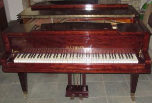 Bluthner Baby Grand Piano, metal framed overstrung movement in mahogany case with arched solid music