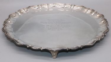 George V hallmarked silver circular salver with raised Chippendale style border, centre presentation