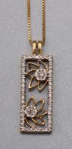 Yellow metal floral panel pendant set with brilliant cut diamonds, on 18ct yellow gold chain,