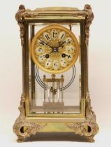 A & N Paris - C19th brass four glass mantle clock, the case with applied rococo mounts, pierced