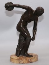 After the Antique; 'Discobolus' the Discus thrower, patinated bronze, on circular marble base, H22cm