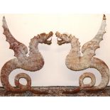 Pair of cast metal Dragon bench seat ends, with wing back supports and open mouth arm rests on