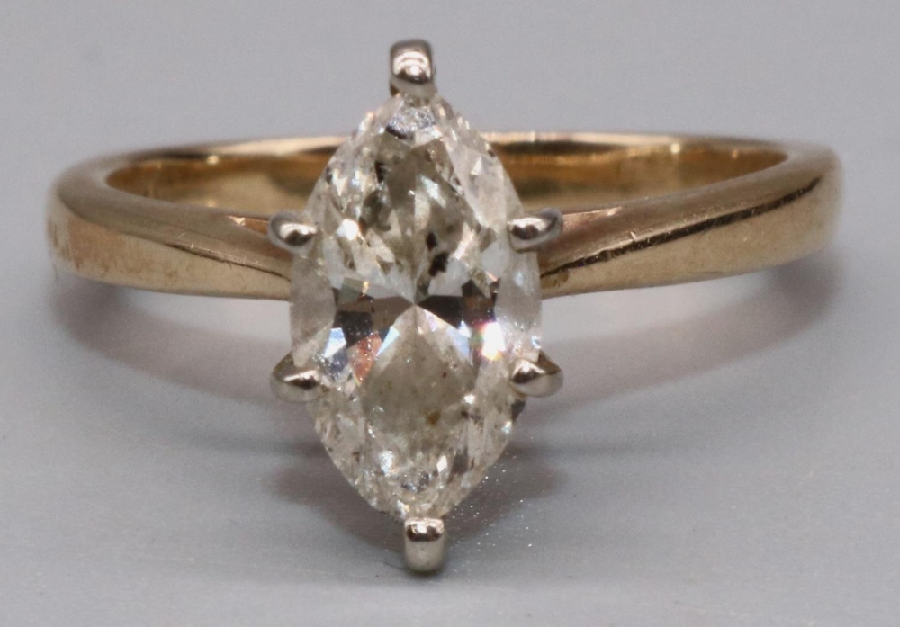 14ct yellow gold diamond solitaire ring set with single marquise cut diamond in claw setting, on