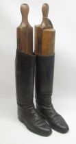 Pair of Vintage black leather riding boots, size 7 1/2 E, with leather soles and four piece wooden