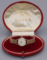 1950's ladies Omega gold wristwatch, signed silvered dial with applied Arabic and baton hours, two