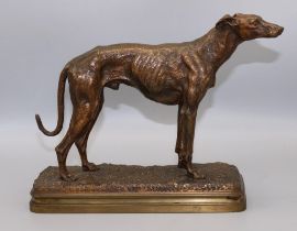 After Alfred Dubucand (1828-1894); Patinated bronze medal of a standing Whippet, signed on