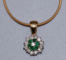 18ct yellow and white gold diamond and emerald cluster pendant set with thirteen brilliant cut