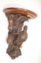 Black Forest style oak wall bracket, D shaped top on game bird support with leafage cresting, top,