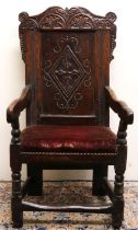 C17th oak wainscot arm chair, scroll and lozenge carved panel back with floral lunette carved