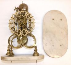 C19th brass skeleton clock on white marble base, the pierced frame of triple turreted Gothic design,