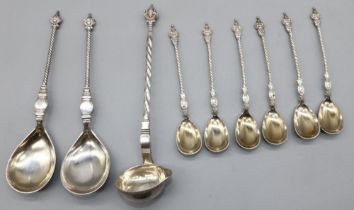 Pair of C20th Danish silver serving spoons, with mask head terminals, barley twist handles and