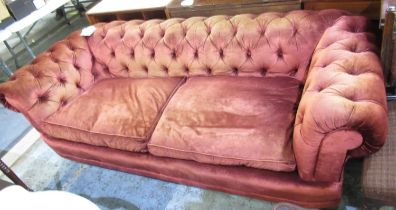 Chesterfield type sofa, upholstered in velvet with deep buttoned back and loose seat cushions, W210