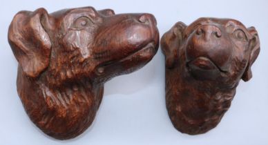 Pair of early C20th relief carved oak models of dogs heads, H16cm W13cm (2)