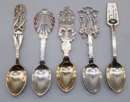 Five C20th Danish silver and enamel Christmas spoons for 1915, 1922, 1926, 1941, and 1946, pierced